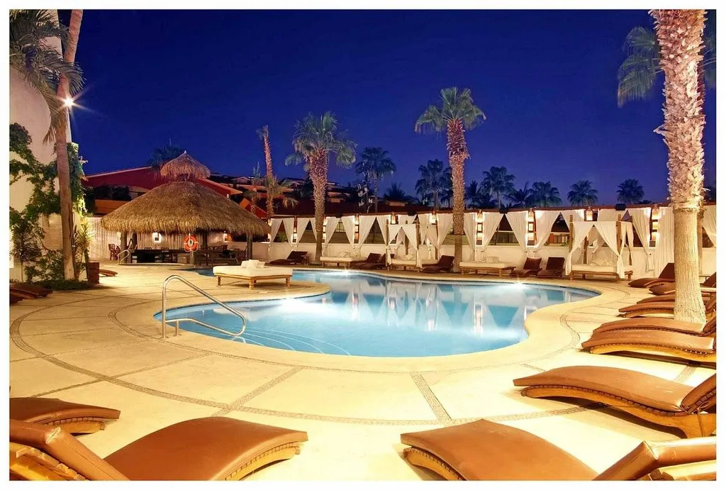 deck chairs around pool at night