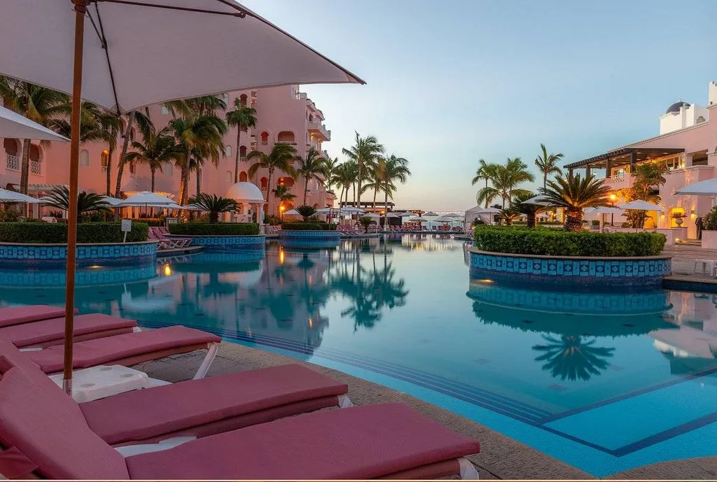 red lounge chairs around pool