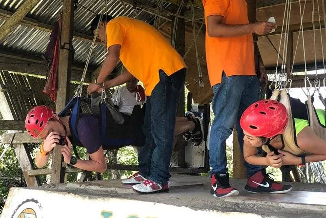 two people getting harnessed for zipline
