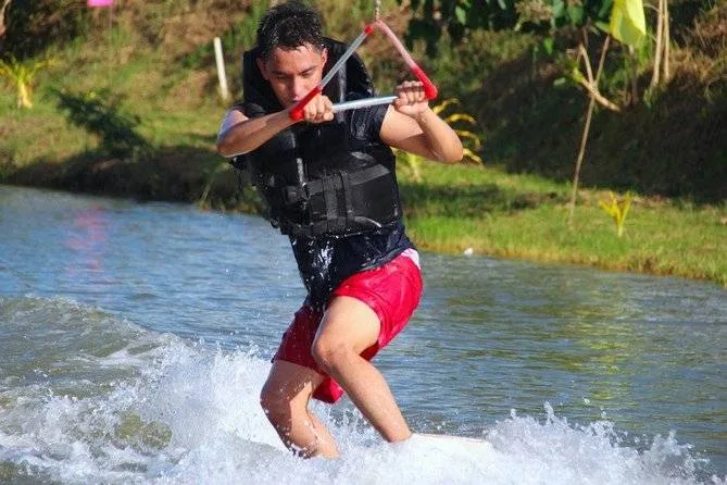 man in red shorts kite surfing