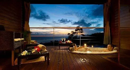 resort patio overlooking ocean at sunset