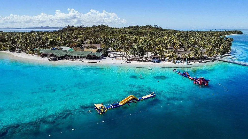 island surrounded by tropical waters