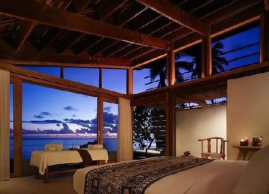 open air resort room looking at ocean at dusk