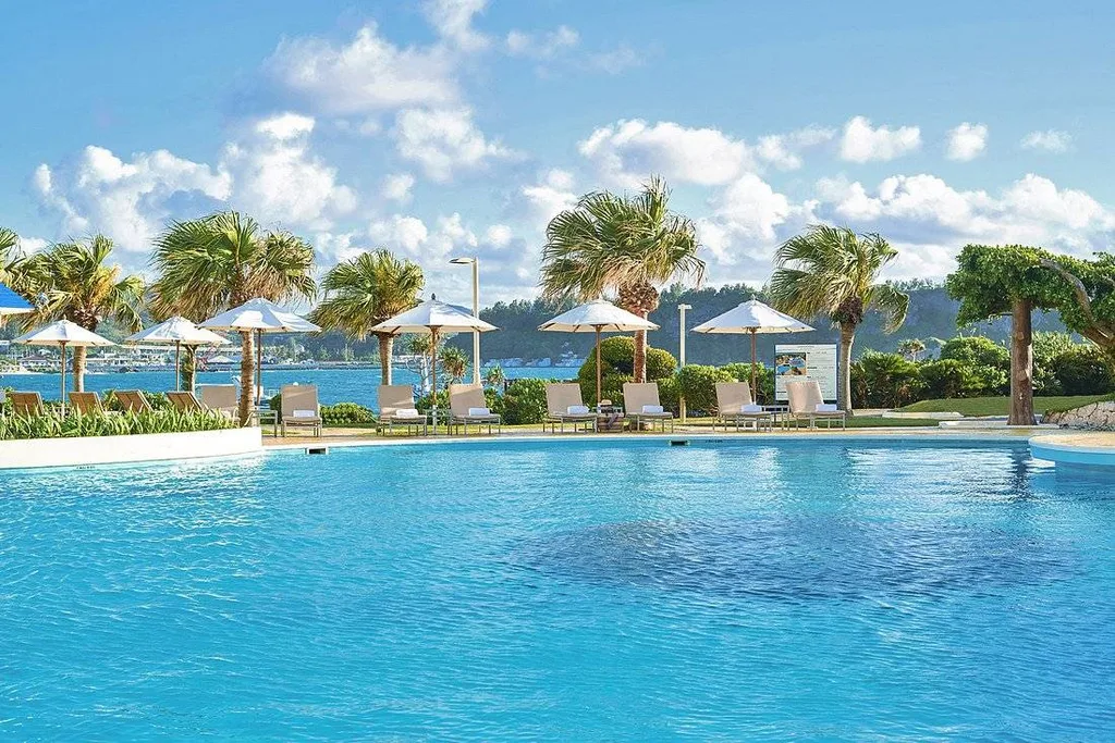large resort pool with palm trees