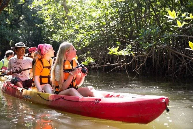 group of people in canoe on river