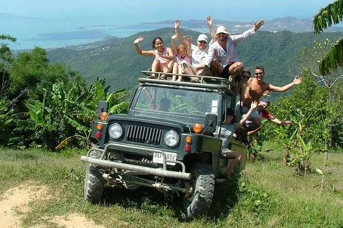 crowd of people piled into a jeep