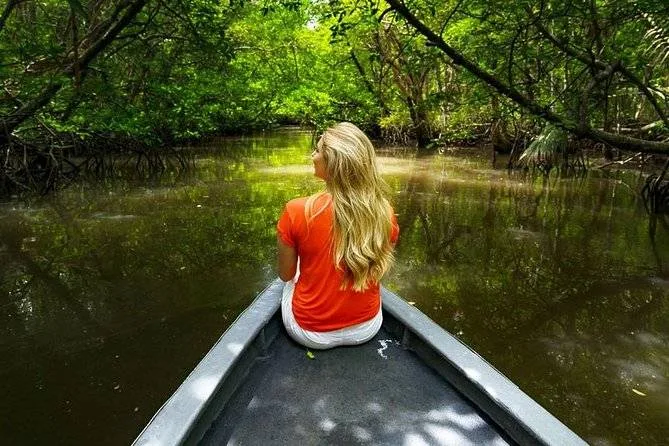 woman in boat floating on river