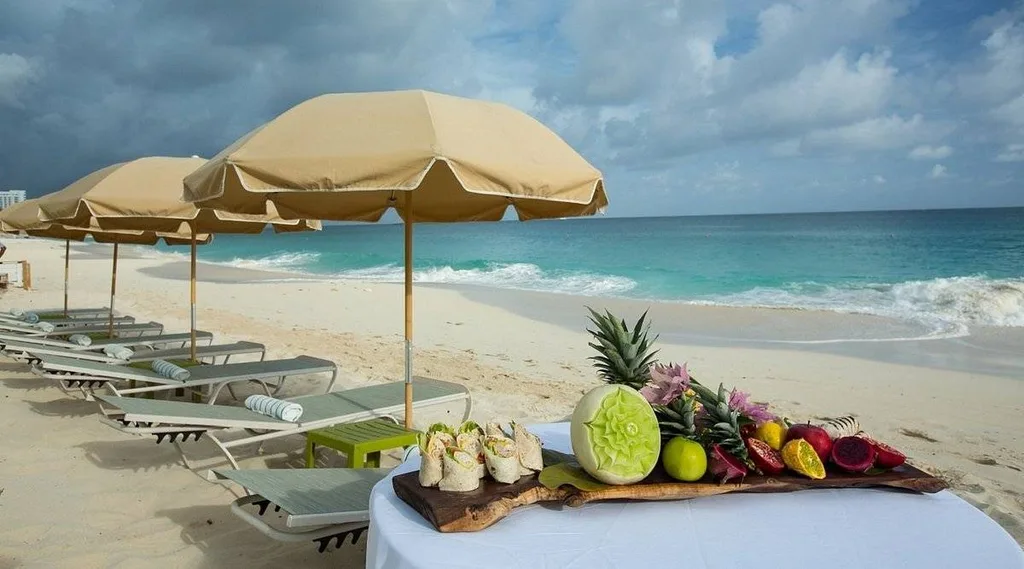 lounge chairs and umbrellas along a beach