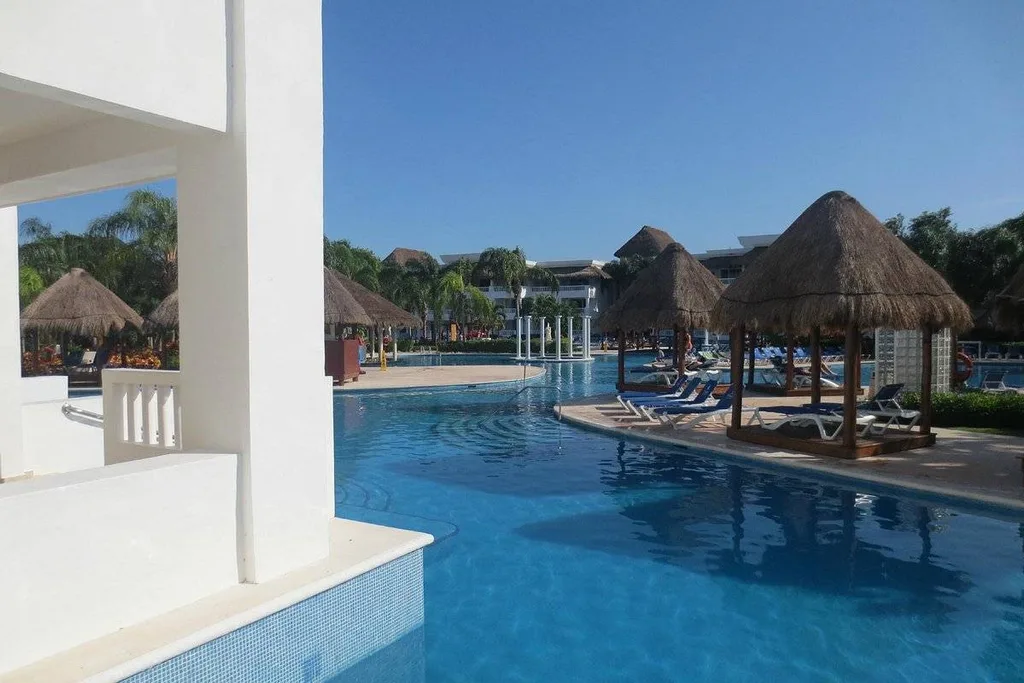 resort pool running past rooms