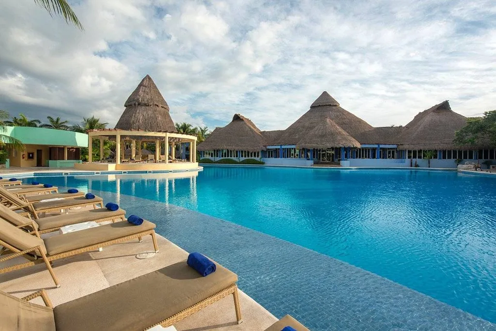 large resort pool surrounded by lounge chairs