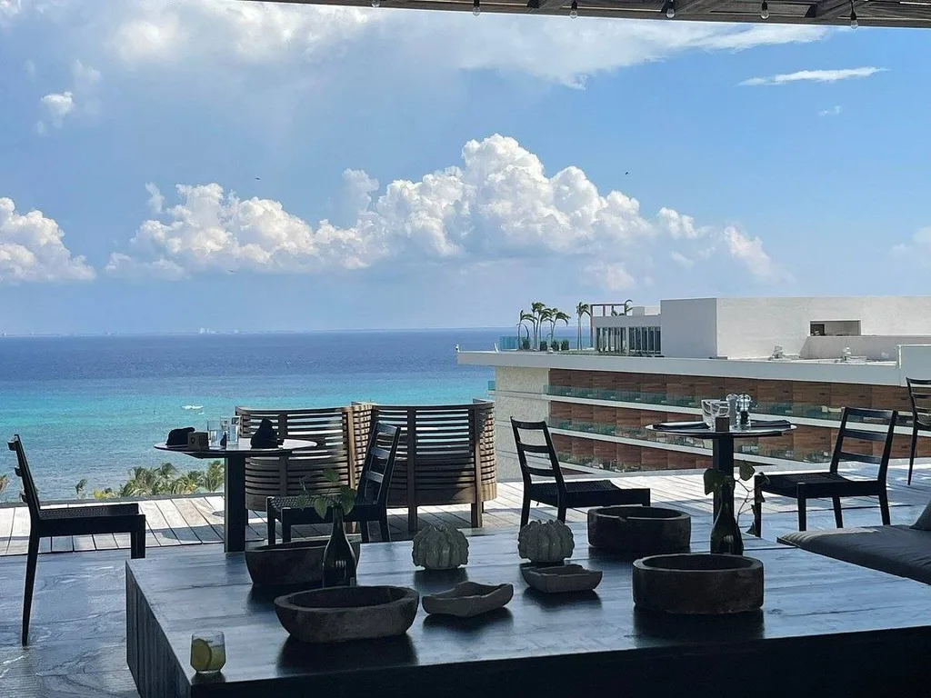 dining tables on covered patio at the beach