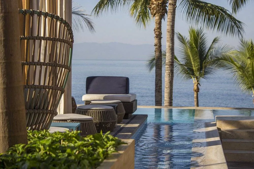 small private resort pool with palm trees