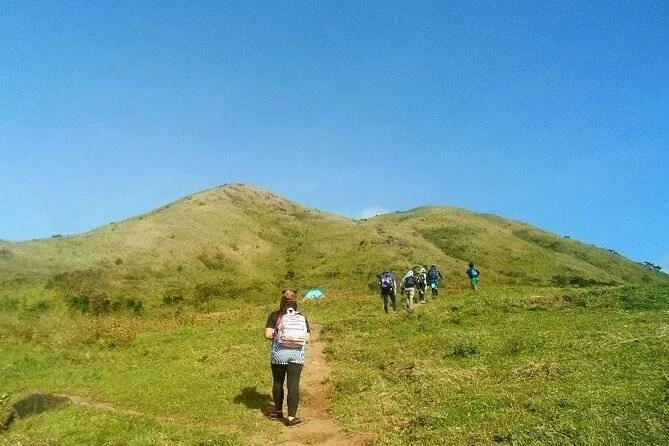 people hiking up to mountain