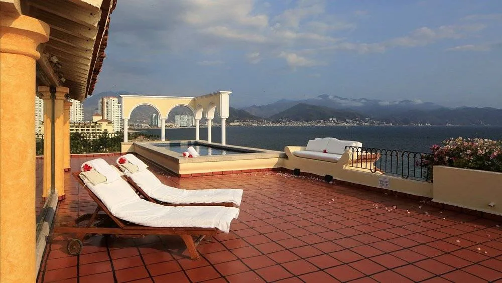 lounge chairs on tile patio at beach