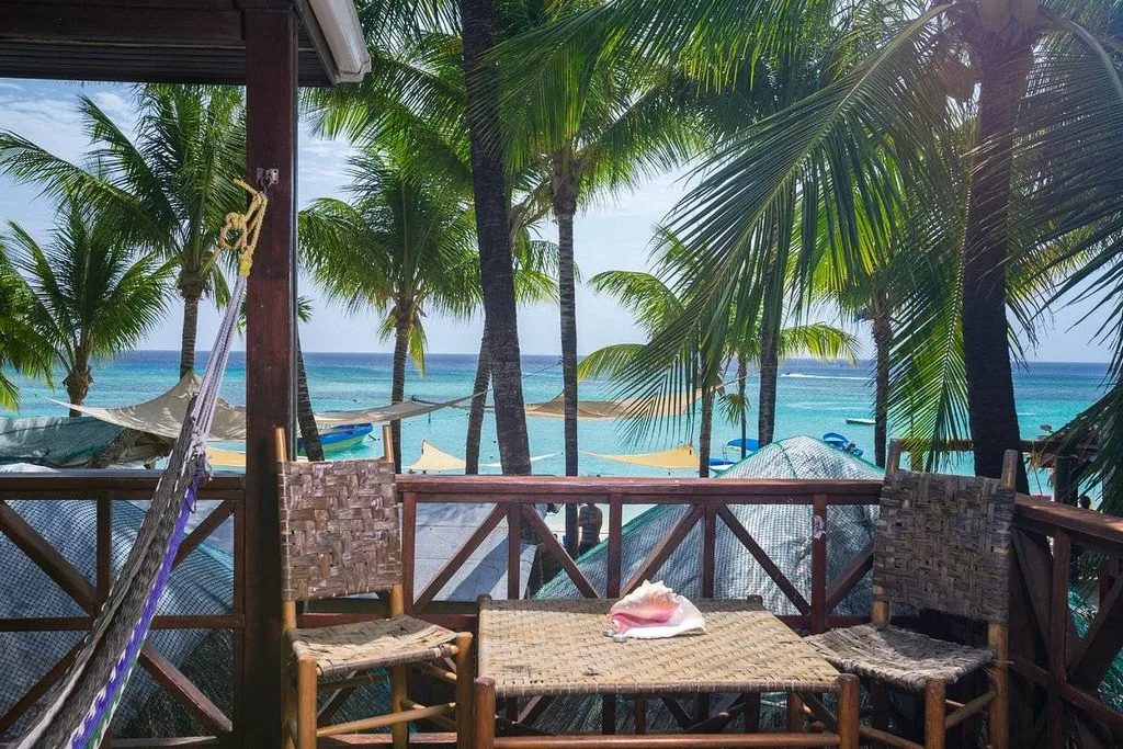 table and chairs on patio on the beach