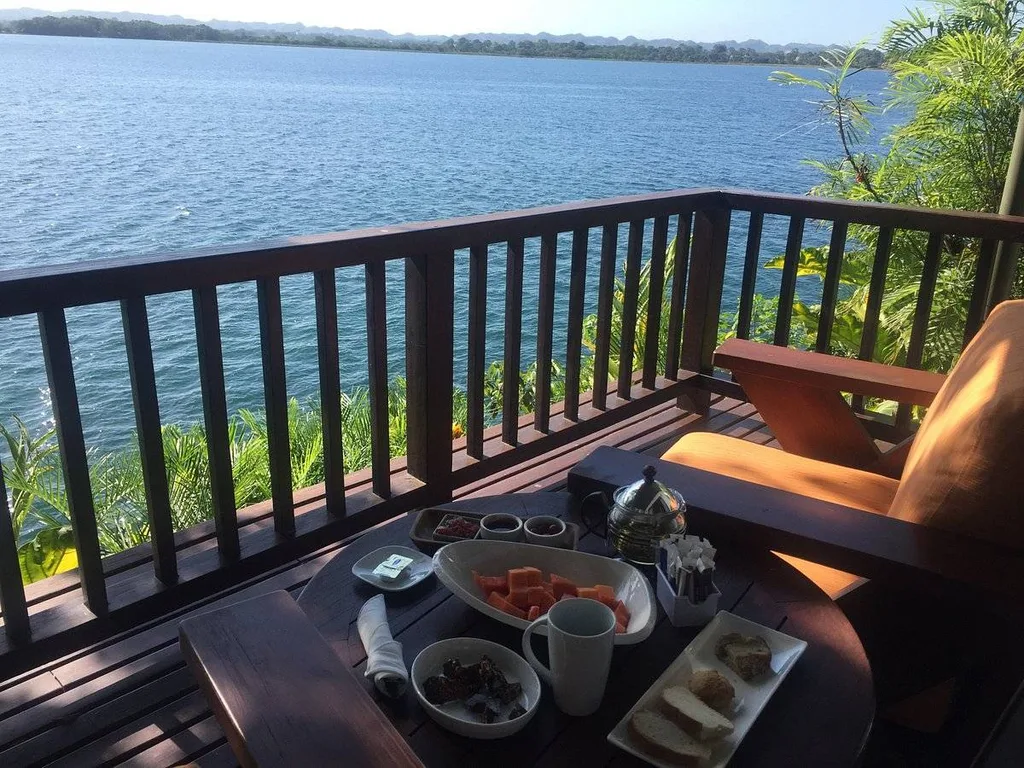 chair and table on patio at water