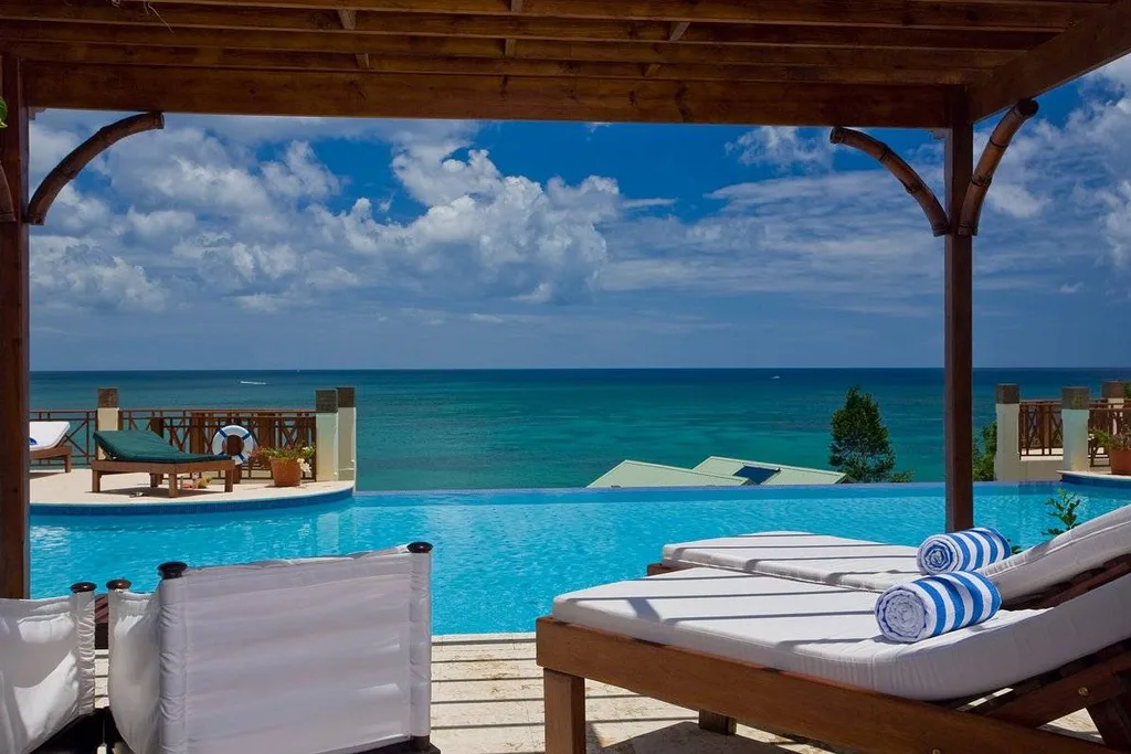 lounge chairs under patio at the beach