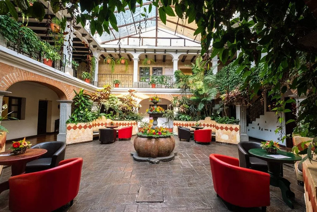 courtyard with 4 red chairs