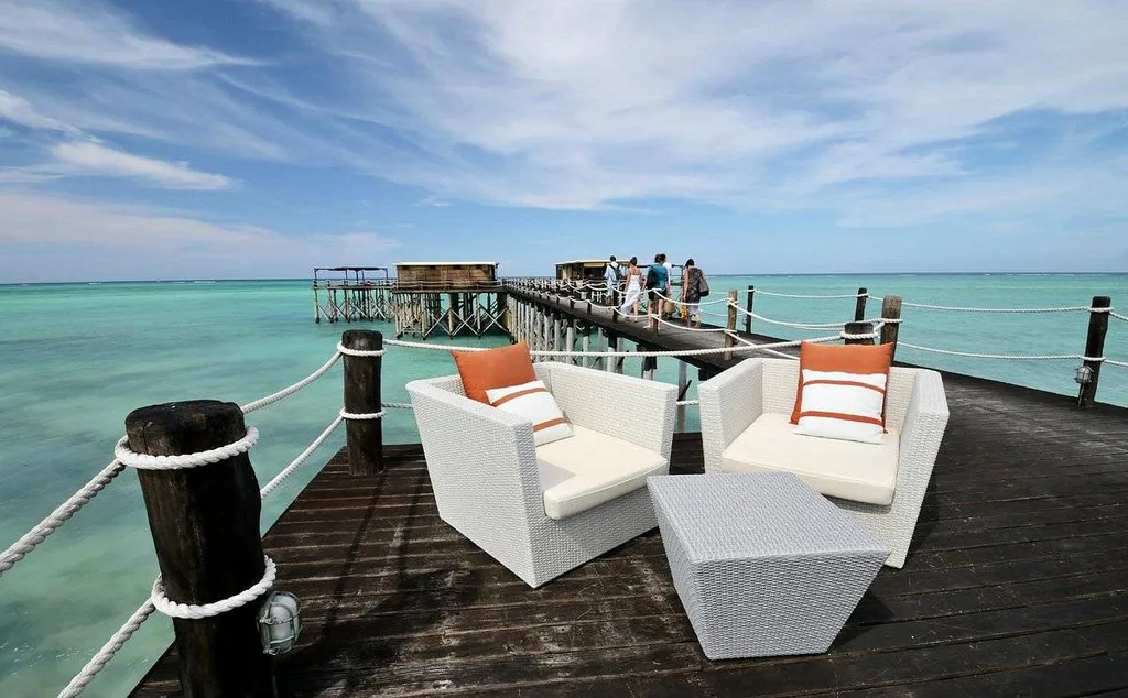 white chairs on wood deck over the water