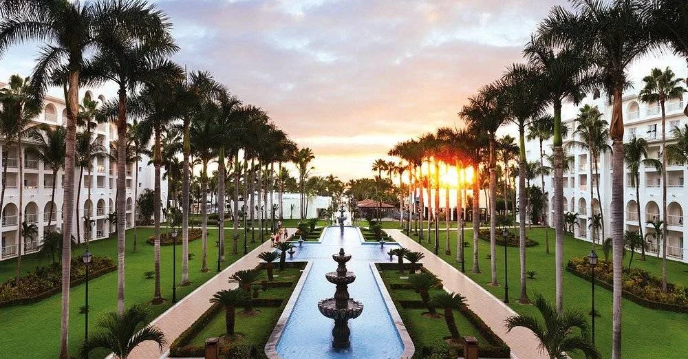 two resort buildings with narrow pool in middle