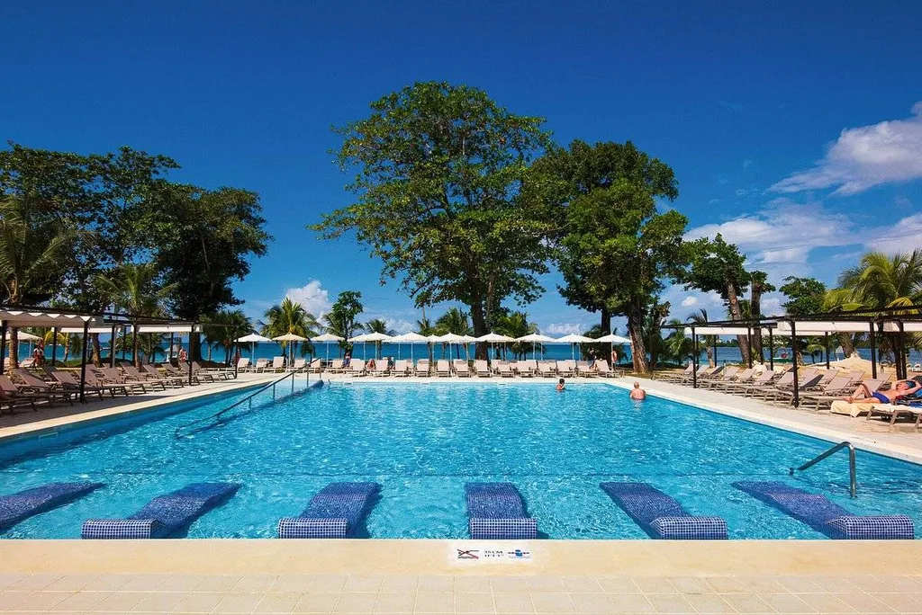 resort pool with blue lounge chairs