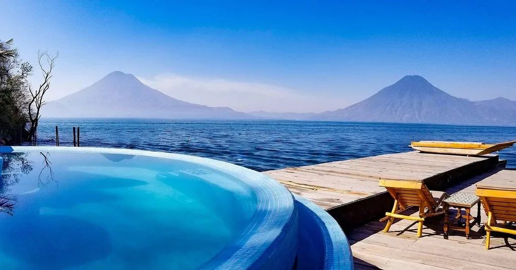 round infinity pool with mountains in background