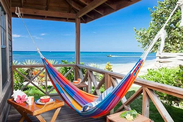 multicolored hammock on porch at the beach