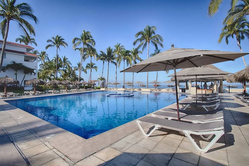 square resort pool with palm trees