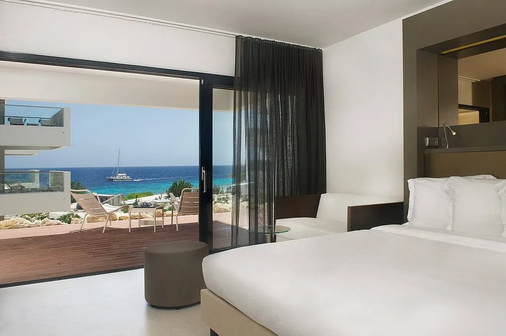 resort room with window looking out to ocean