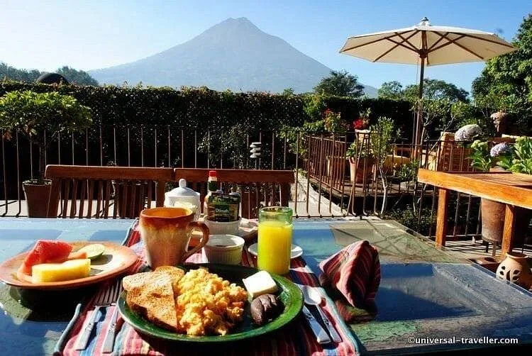 table with breakfast with mountain in background