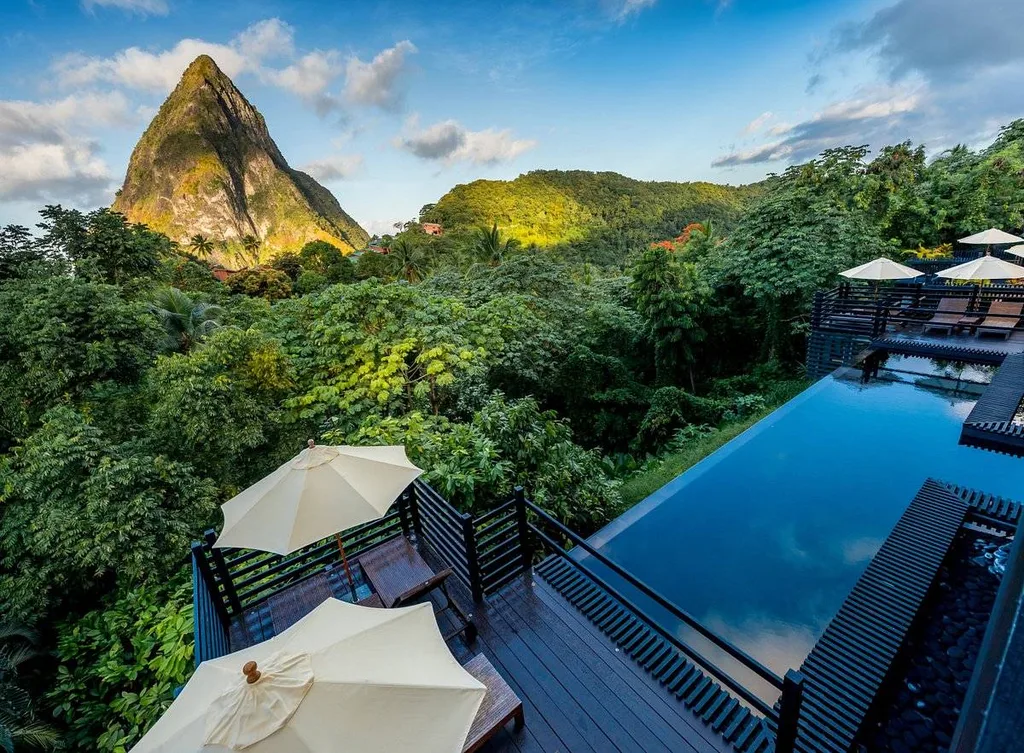 infinity pool with mountain popping up from the jungle