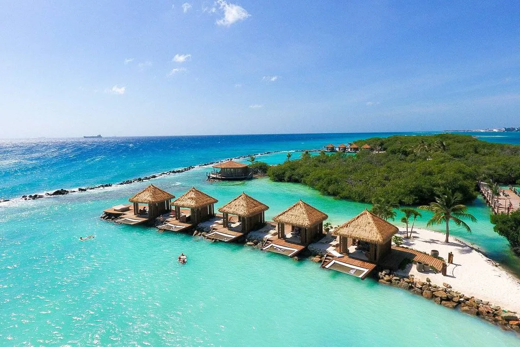 over water bungalos in tropical water