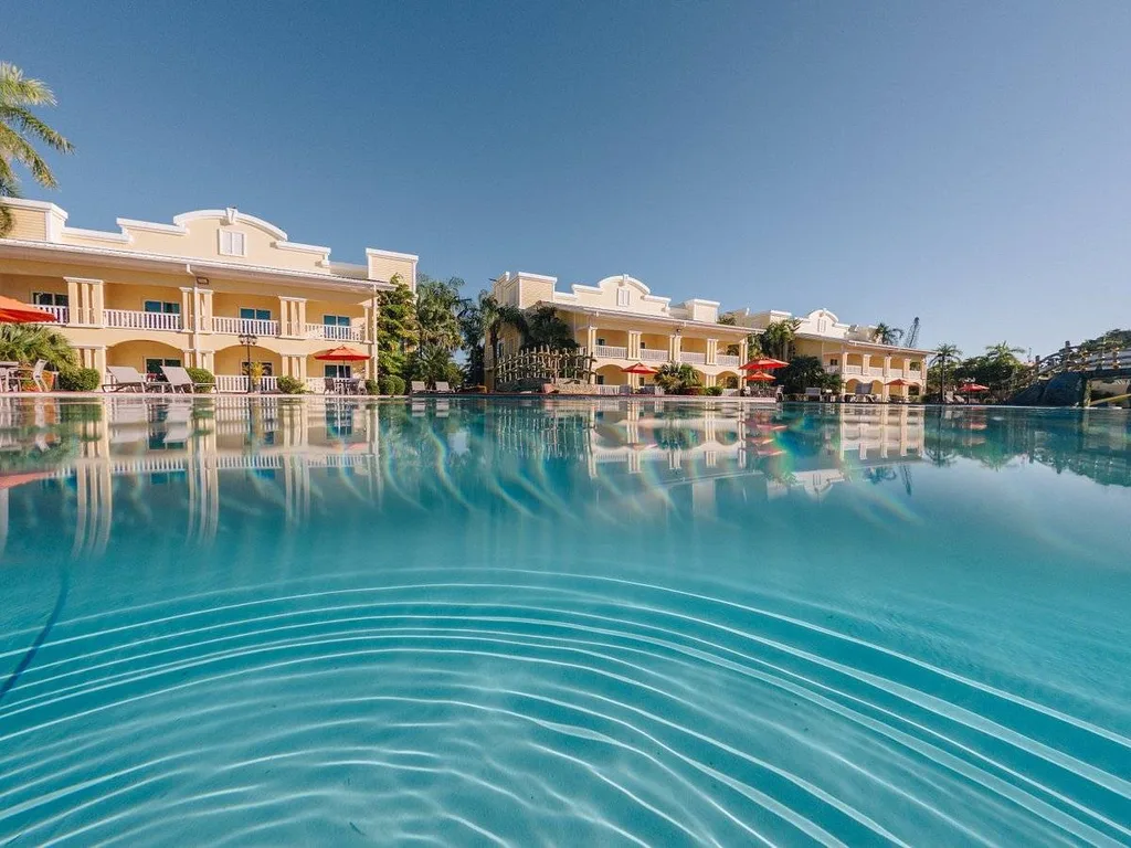 massive pool with resort in background