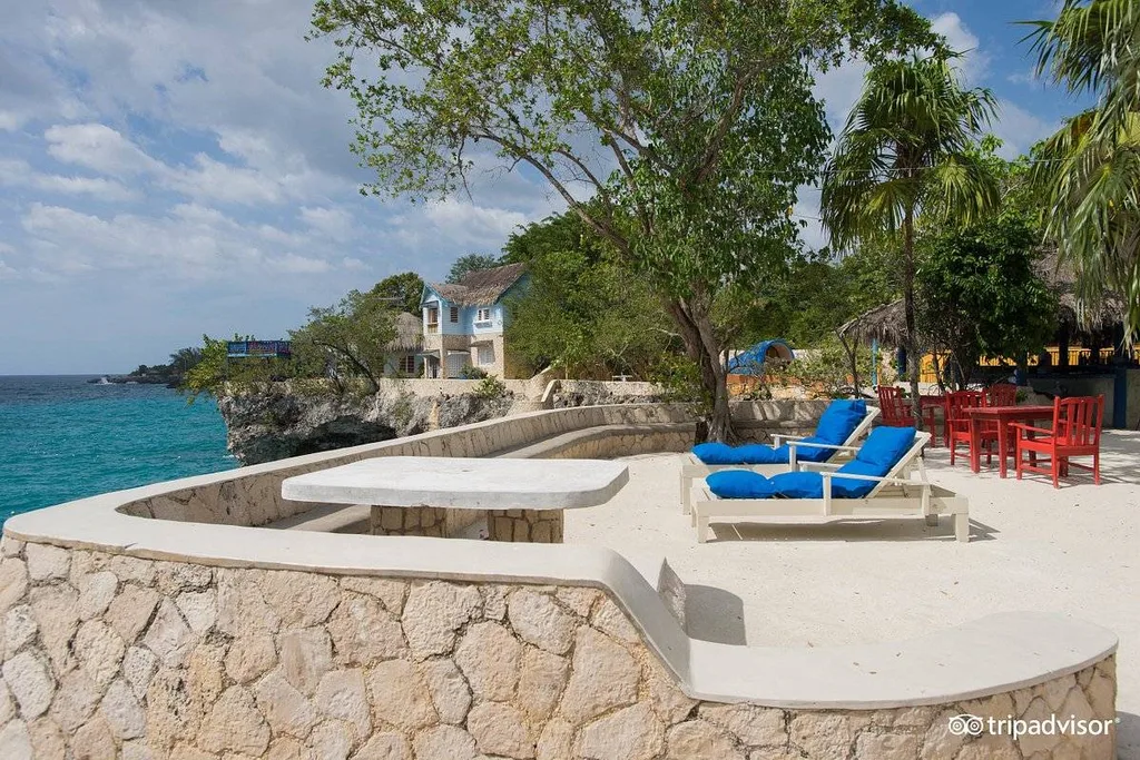 two blue lounge chairs on rock patio