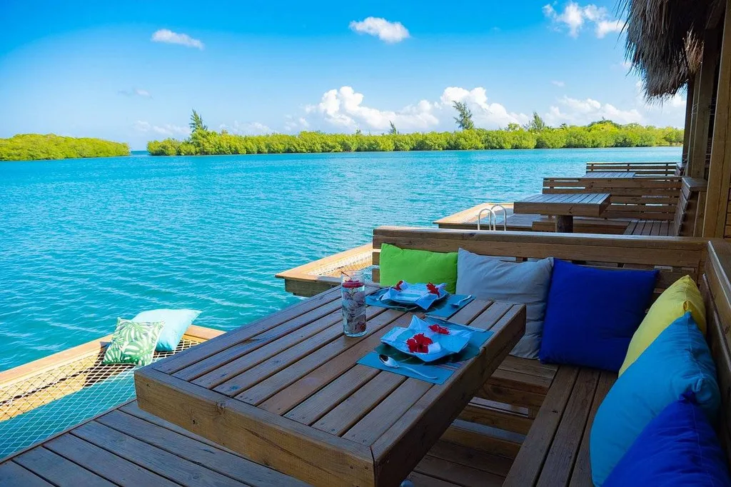multiple wooden decks and tables on the water