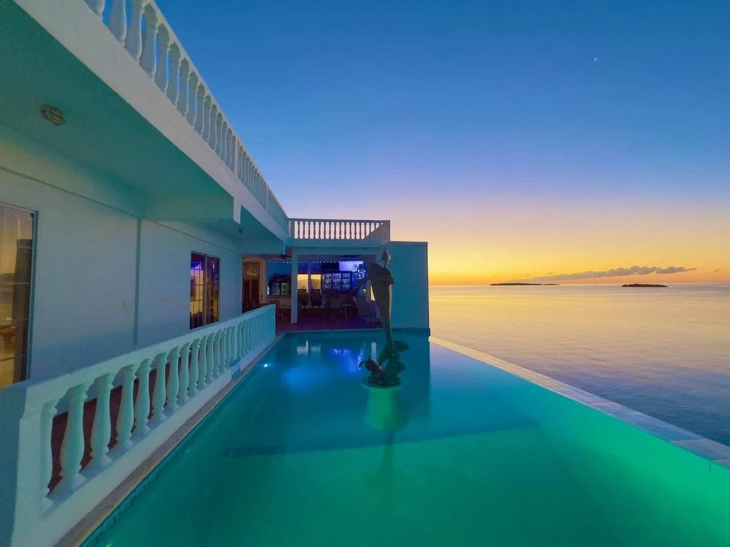 resort infinity pool at night