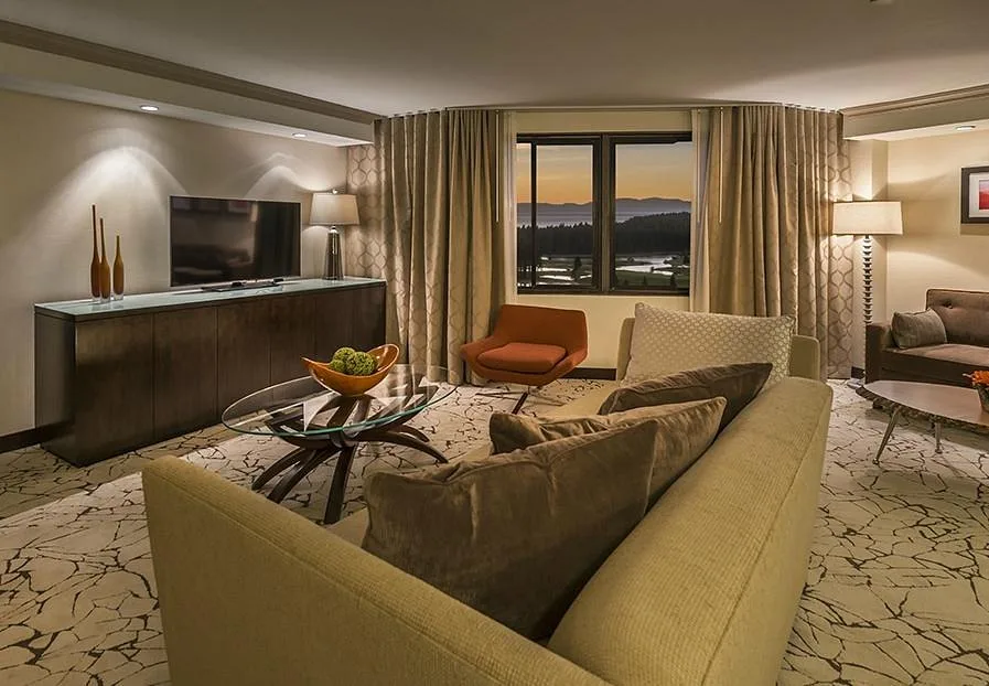 luxury resort room with windows looking out to mountains