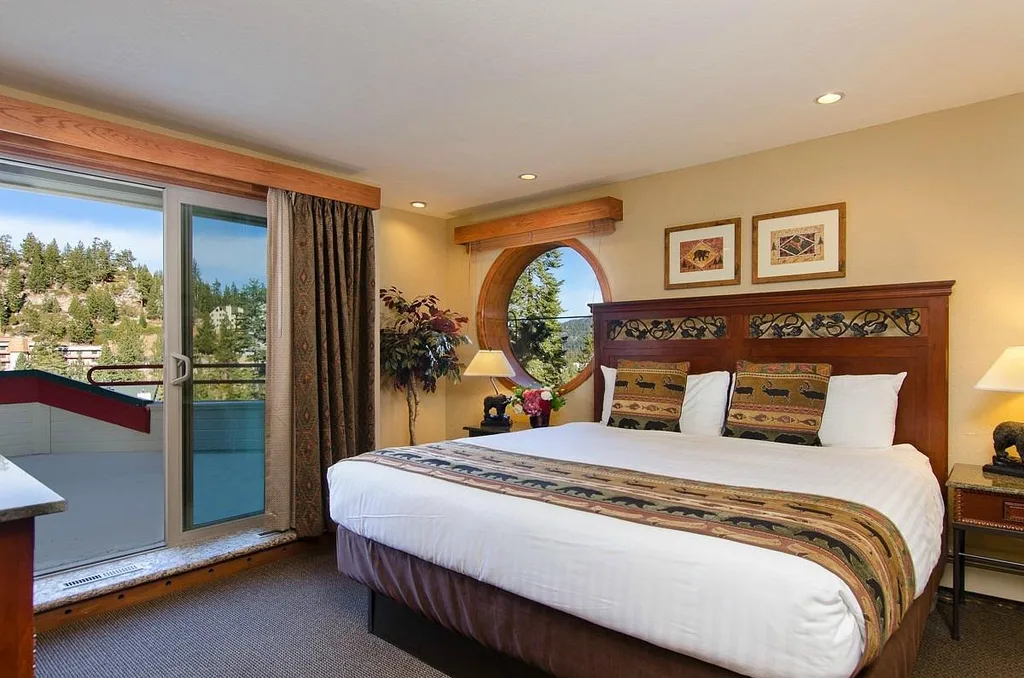 large resort bed with round window