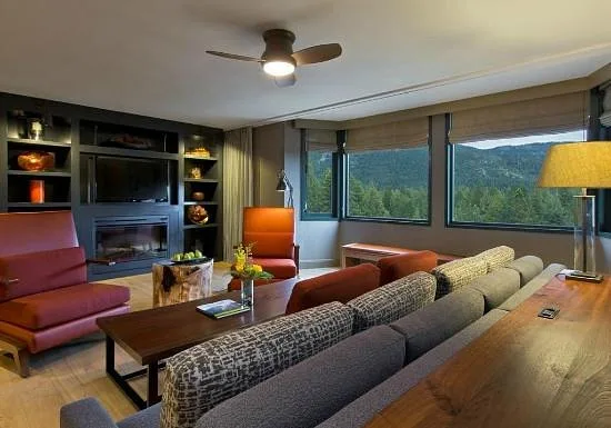 large living area with windows out to mountains