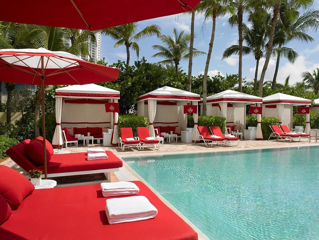 Acqualina Resort & Residences cabanas with red cushions