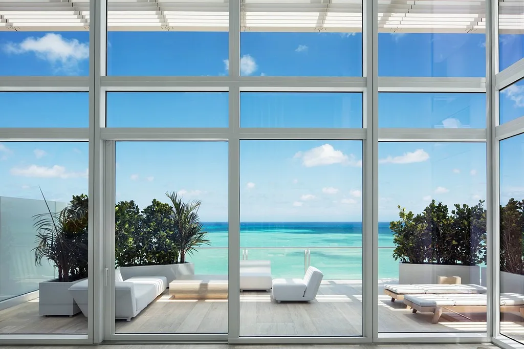 Four Seasons Hotel at The Surf Club private patio with white chairs