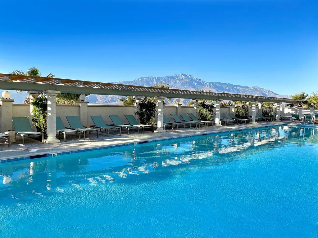 large resort pool with mountain in the background