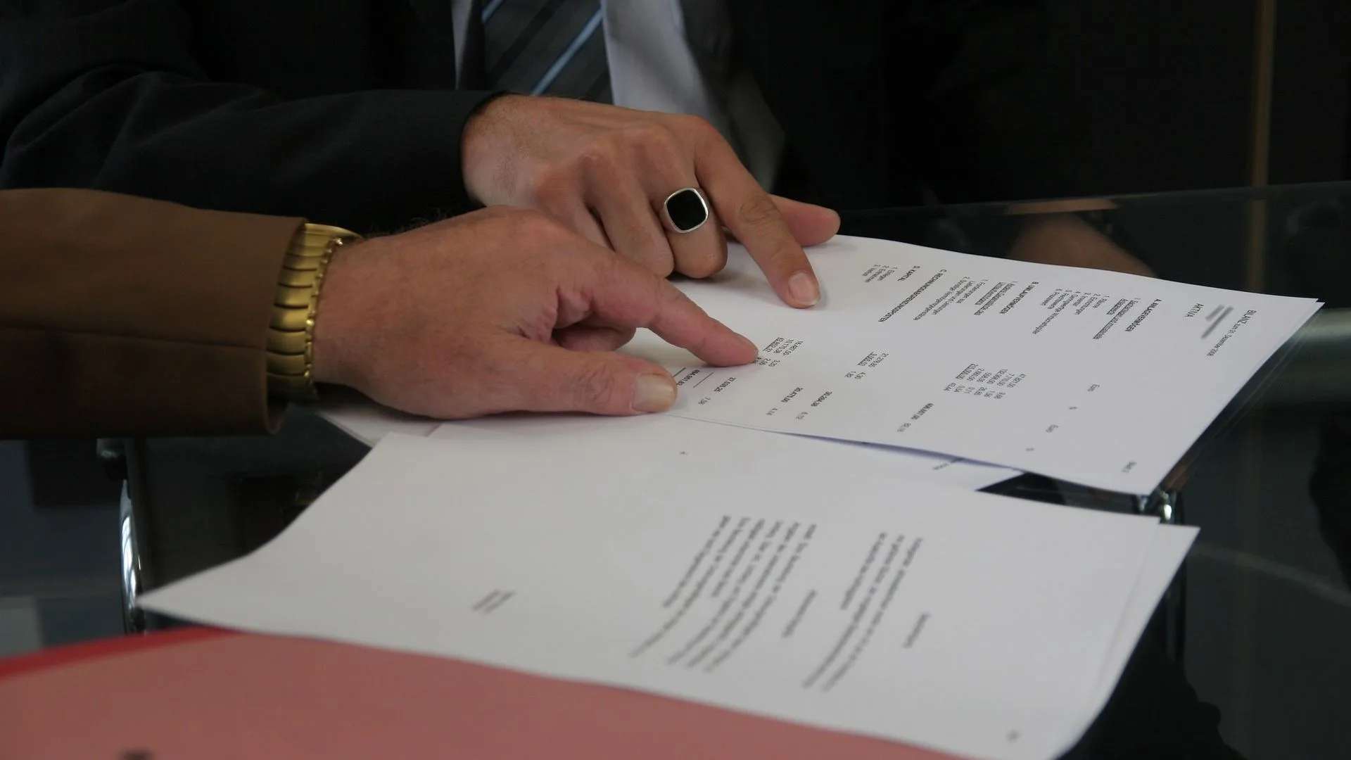 two men signing a contract