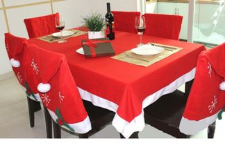 A Set of Santa Hat Christmas Tablecloth and Chair Covers for Dinner Room