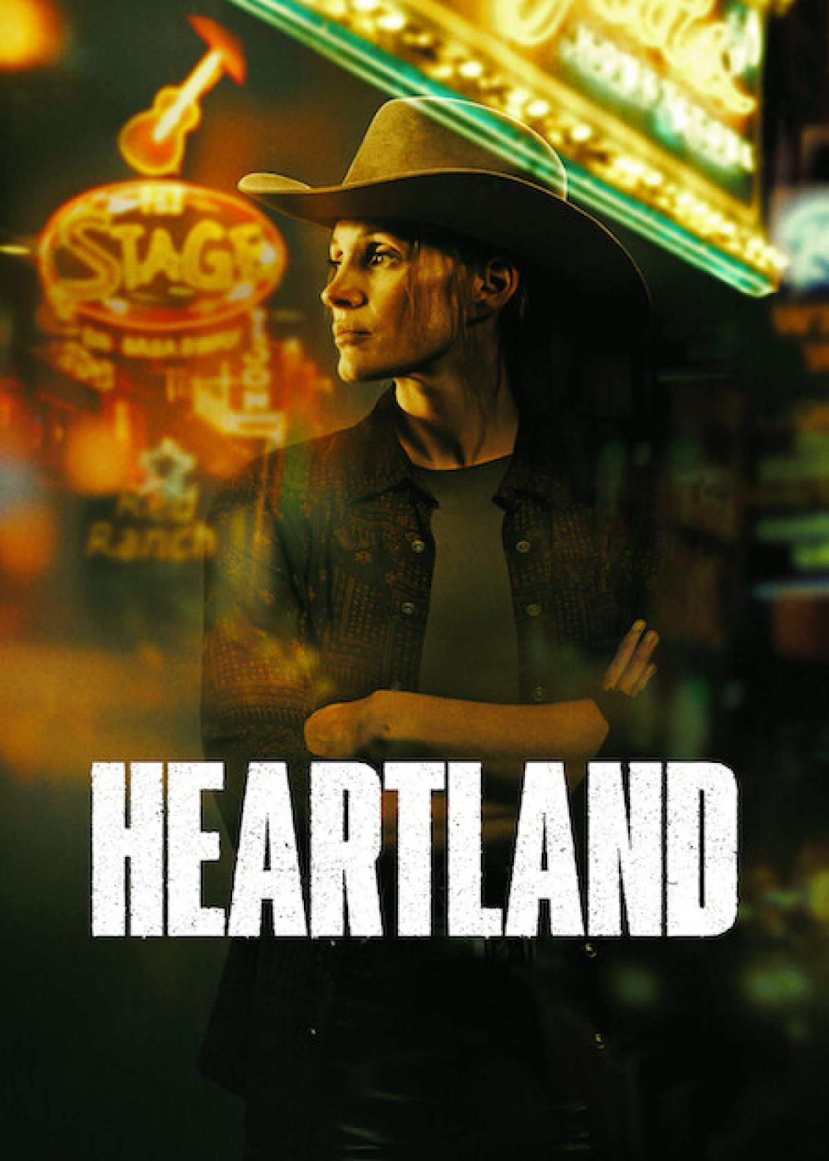 Heartland afişinde neon ışıklı sokakta kovboy şapkasıyla duran kadın